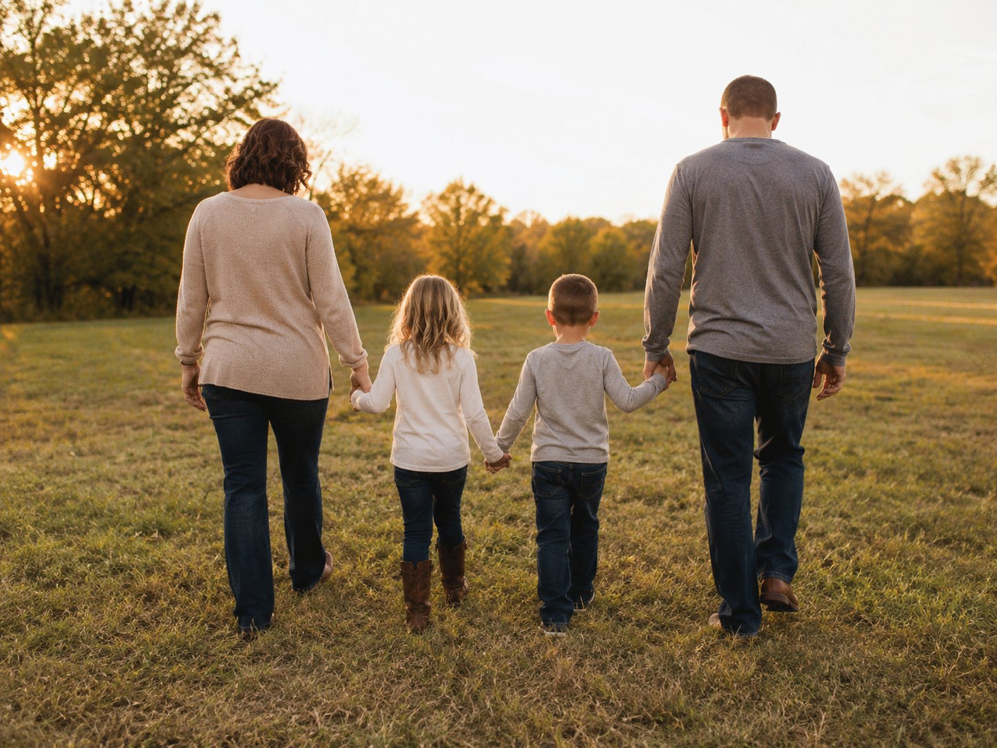 Family walking together at sunset